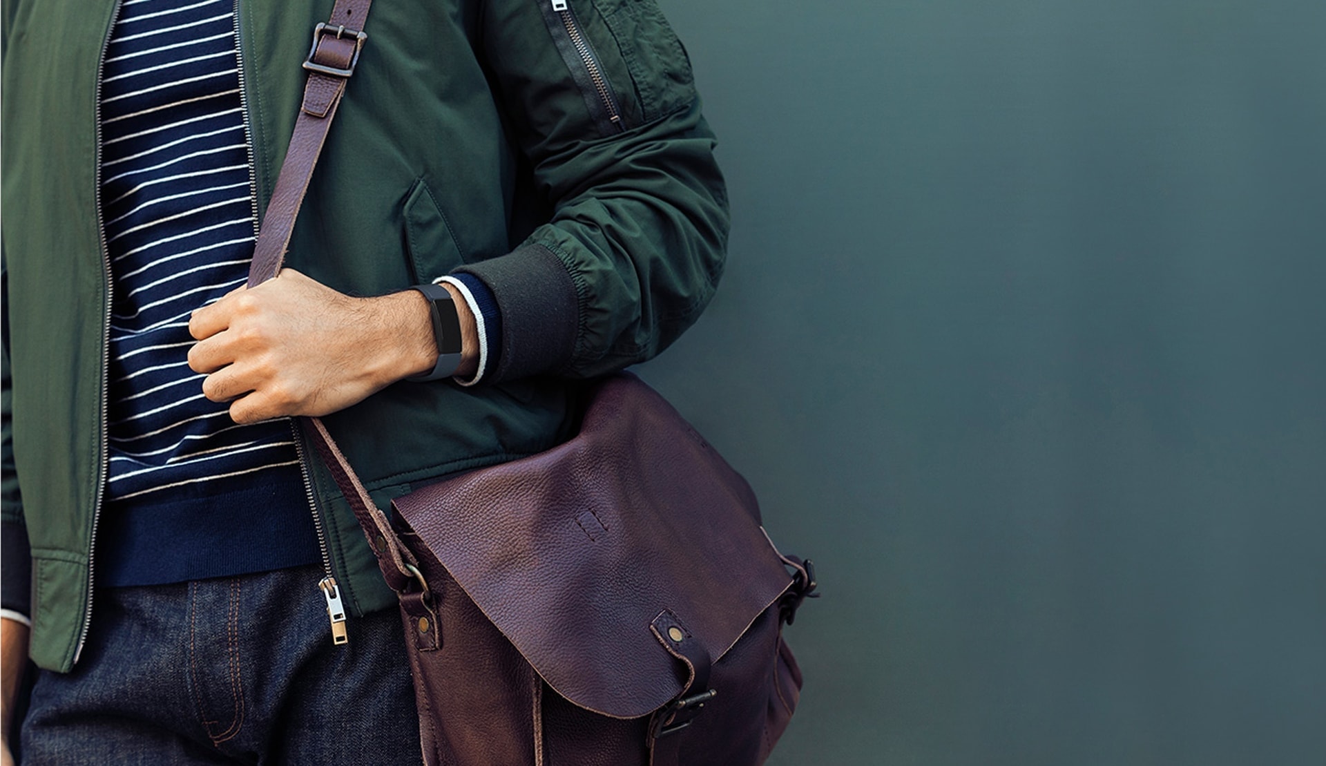 Man with Fitbit Fitness Tracker and leather bag